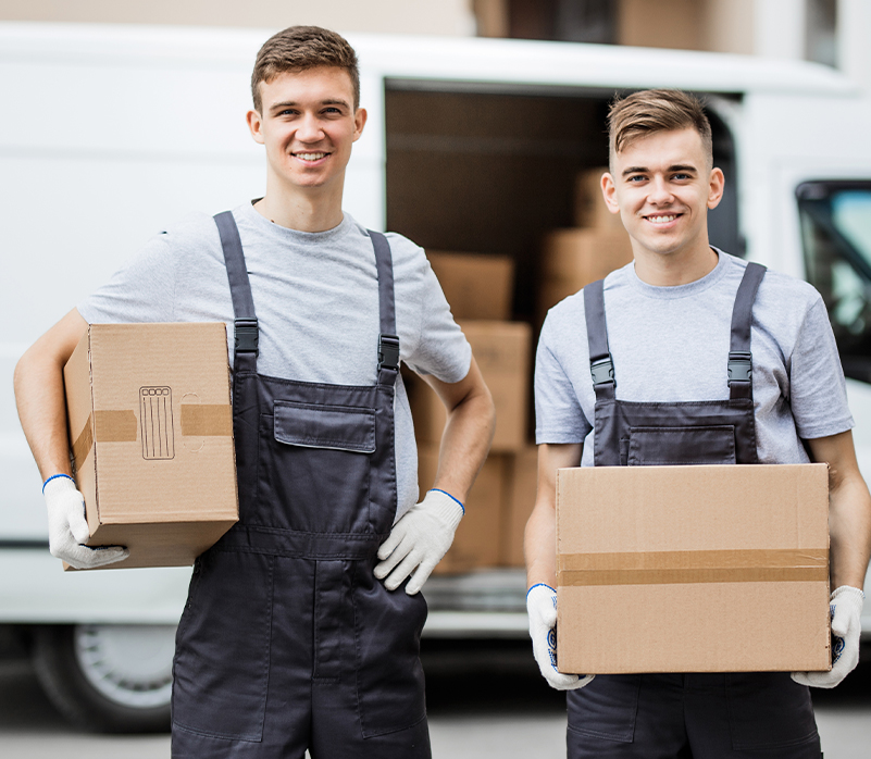 Shine Movers professional movers carrying boxes beside a moving truck